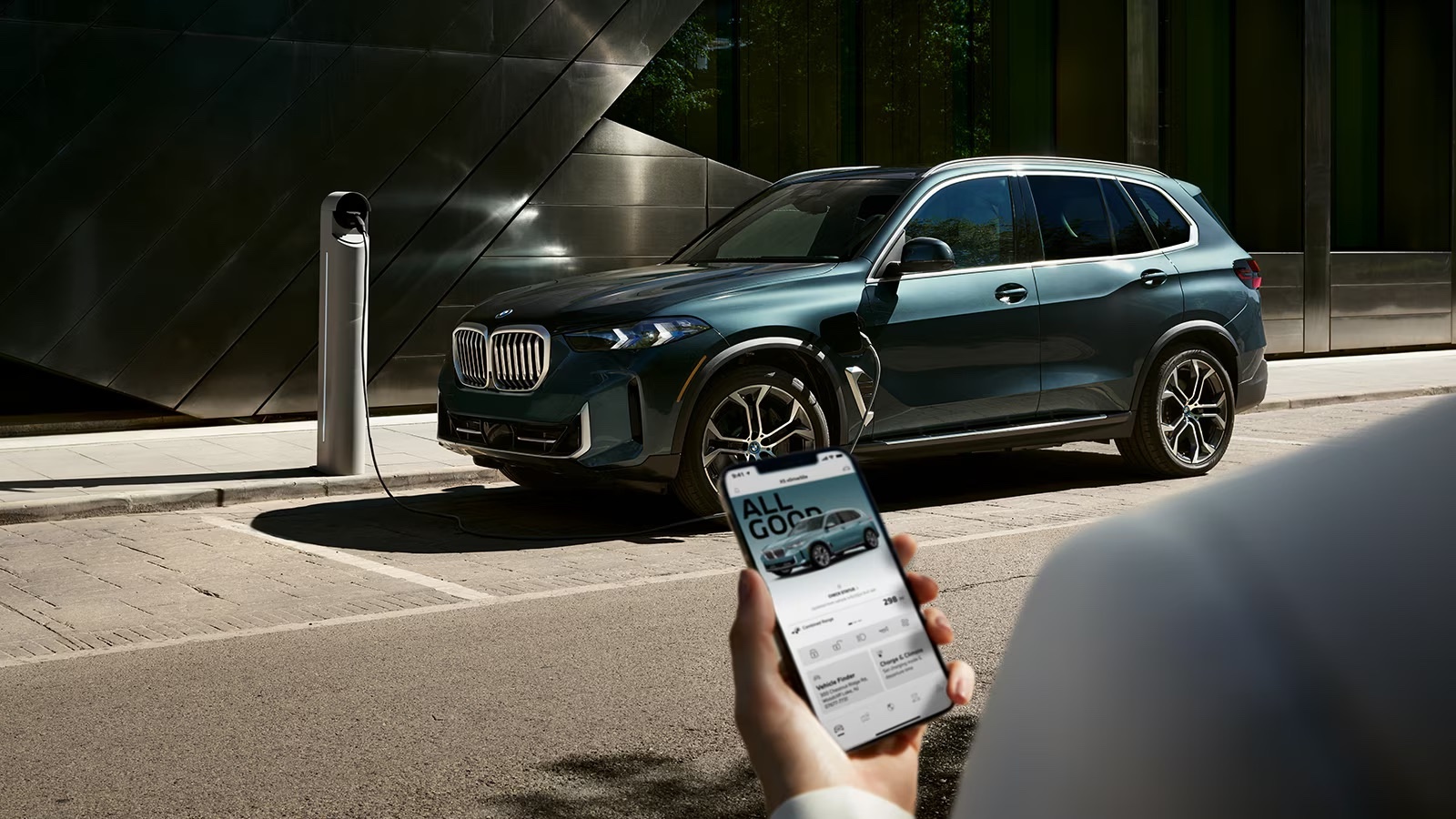 Rear profile of the 2025 Volvo XC90 beside the BMW X5, emphasizing XC90 trunk space and BMW X5 cargo capacity for family travel.