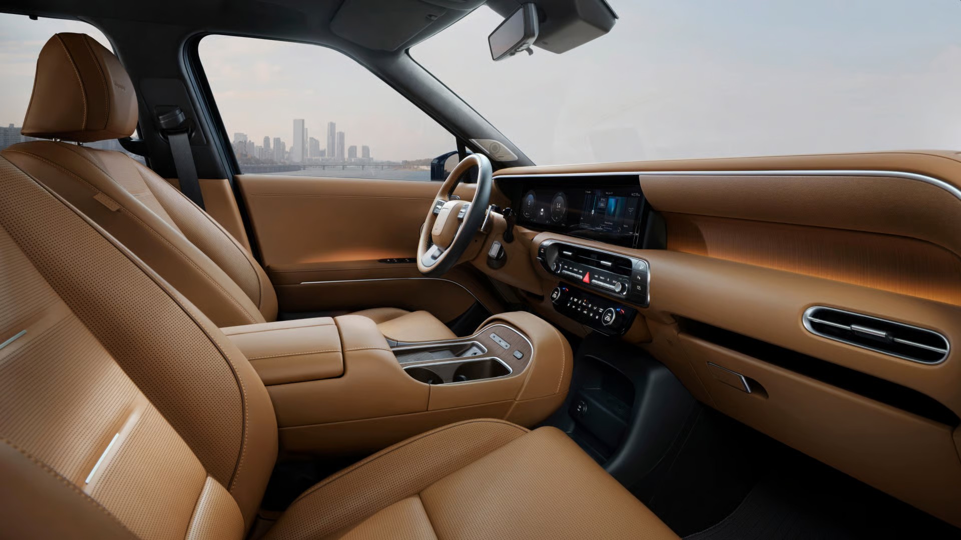 Digital cluster and infotainment inside the Palisade with skyline view at AutoFair Hyundai of Manchester
