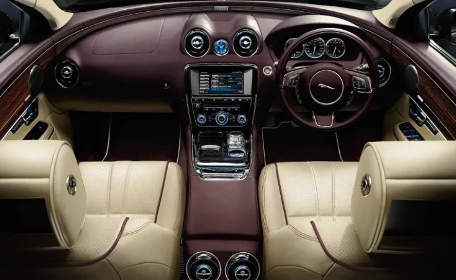 Jaguar XJ EV 15 min charge, 200 mile charge in 15 min, Jaguar XJ EV 120k price, XJ EV Adaptive Dynamics, Jaguar 450+ horsepower, XJ EV dual motor AWD, XJ EV four-wheel steering, Jaguar 90 kWh battery, XJ EV top speed, XJ EV air suspension, XJ EV low drag design, Jaguar EV performance, XJ EV aluminum construction, XJ EV battery preconditioning, XJ EV luxury technology.