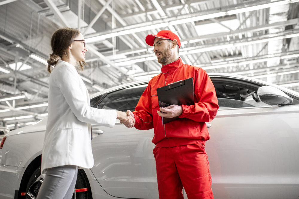 Mercedes-AMG service handshake, AMG Express Service Westminster CO, luxury car customer service Mercedes-Benz, AMG break-in consultation Westminster, Mercedes-Benz certified AMG technician greeting, premium AMG service appointment Colorado