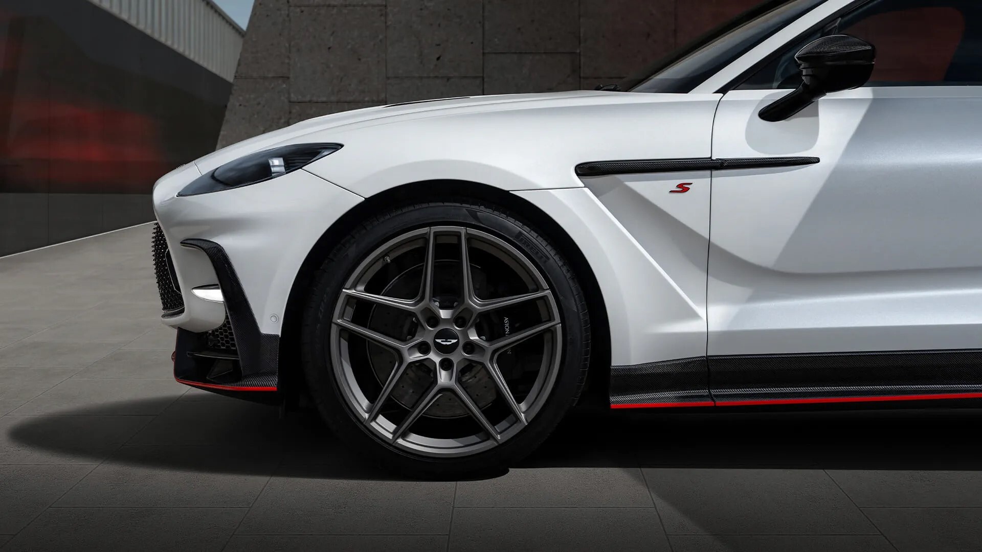 2026 Aston Martin DBX S dynamic side profile in motion