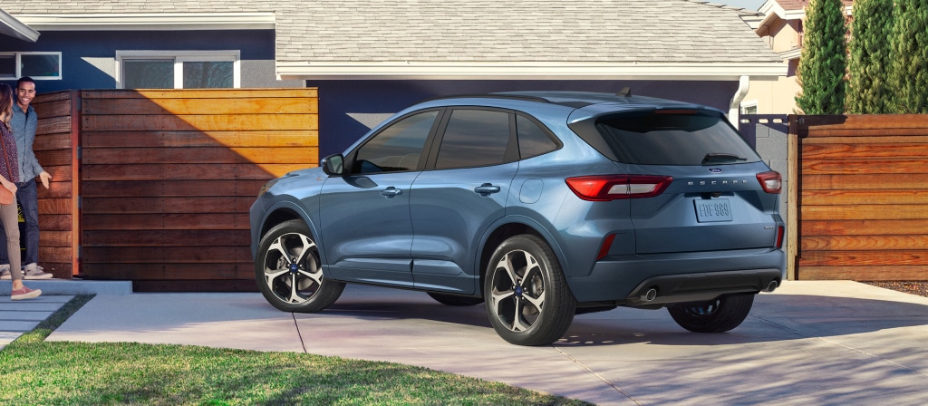 2025 Ford Escape Hybrid parked at home, Ford hybrid SUV with home charger, plug-in Escape Manchester NH, Ford Escape hybrid daily commute New England, EV-ready driveway charging, Ford Escape efficiency MPG, hybrid SUV for families Manchester New Hampshire
