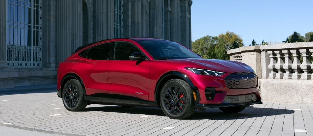 2025 Ford Mustang Mach-E Premium red electric SUV, Mustang Mach-E EV Manchester NH, Mach-E range and performance, Ford Mustang Mach-E vs Tesla Model Y, Ford electric crossover design, EV SUV near Manchester New Hampshire, Mustang Mach-E sleek styling