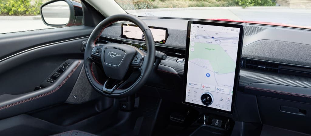 2025 Ford Mustang Mach-E interior tech, Mach-E touchscreen with navigation, Ford SYNC 4 interface, electric SUV Apple CarPlay, BlueCruise 2.0 Mustang Mach-E, EV dashboard layout Manchester NH, Mustang Mach-E driver cockpit electric SUV, Ford electric interior design