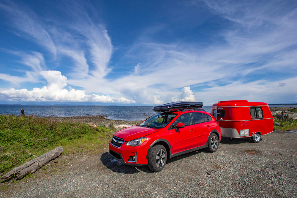 Subaru Crosstrek towing trailer, Subaru camping gear setup, roof box for Crosstrek, New England coastal camping, Subaru trailer hitch installation Haverhill, Subaru Crosstrek with roof-mounted cargo box, Subaru off-road travel, towing trailer with Subaru, Subaru Crosstrek adventure travel New Hampshire, Subaru outdoor lifestyle near Merrimack River