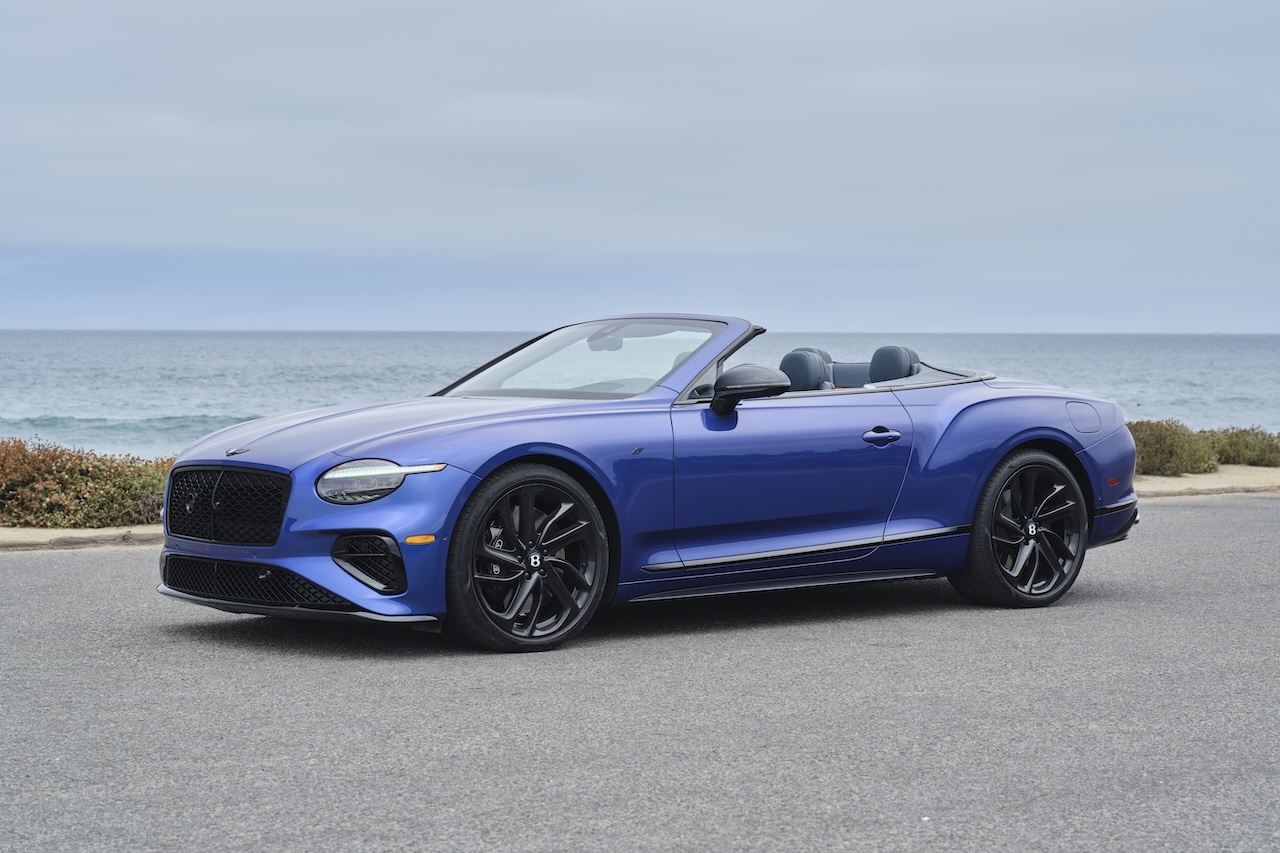 Blue Bentley Continental GTC convertible with roof down in Naples, Florida