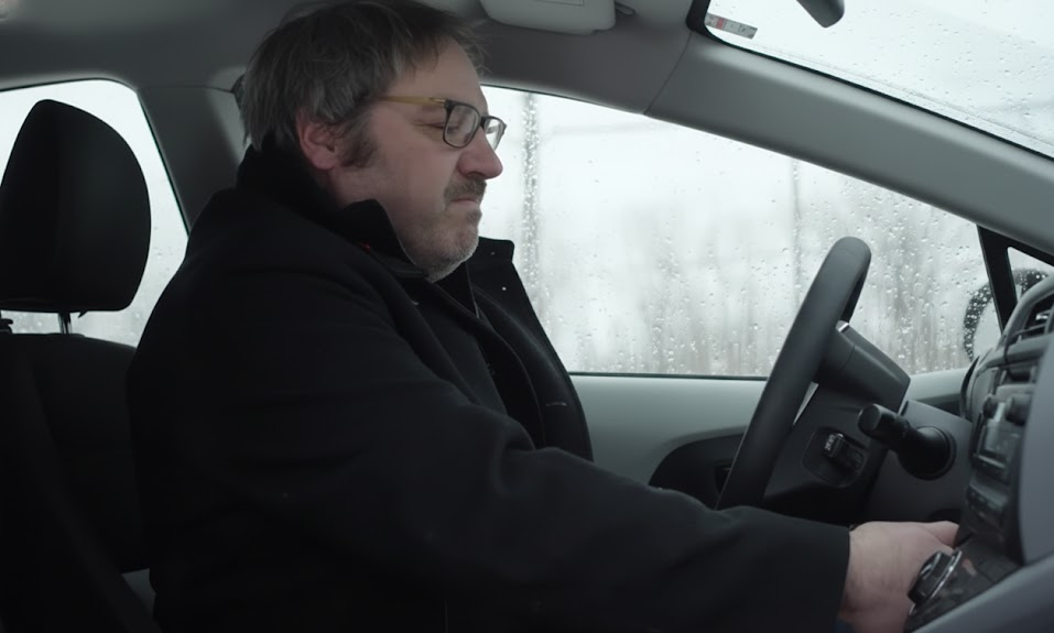 Driver sitting in BMW trying to start car on freezing winter morning, BMW will not start in cold weather, weak BMW battery symptoms, slow crank issue in Freeport NY, Long Island winter starting problems, signs you need BMW battery registration and testing, Nassau County BMW stranded in driveway, cold climate draining BMW battery, BMW of Freeport Service Center winter battery check reminder