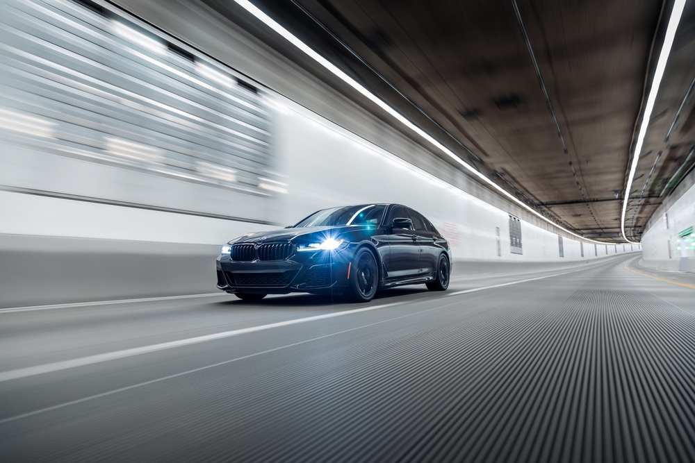 BMW driving Freeport to Hamptons, BMW performance car Nassau County, luxury vehicle tunnel drive, black BMW 5 Series repair service Freeport NY, BMW wheel restoration for road trips