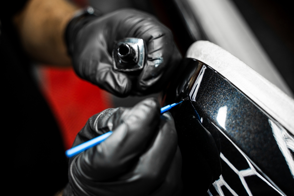 BMW paint chip repair Long Island, professional touch-up BMW Freeport, certified collision center Nassau County, luxury car paint correction Freeport NY, BMW Freeport Collision technician, detail paint restoration BMW black finish