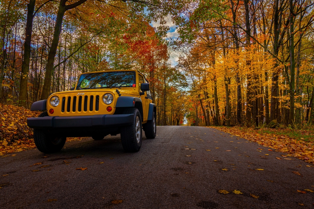 Yellow Jeep fall drive Franklin TN, autumn leaves road trip Jeep Wrangler, fall car care for Jeep Tennessee, scenic fall drive Nashville, end of summer Jeep maintenance checklist, CDJR seasonal driving Franklin