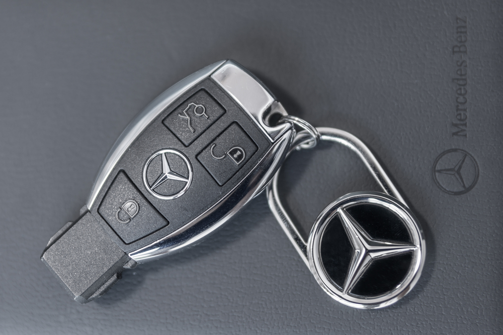 Chrome Mercedes-Benz SmartKey key fob with logo keychain, modern Mercedes key fob design, Mercedes-Benz remote battery replacement Daytona Beach, Mercedes key fob programming Florida, keyless entry Mercedes-Benz of Daytona Beach, luxury vehicle keys, CR2032 key battery info