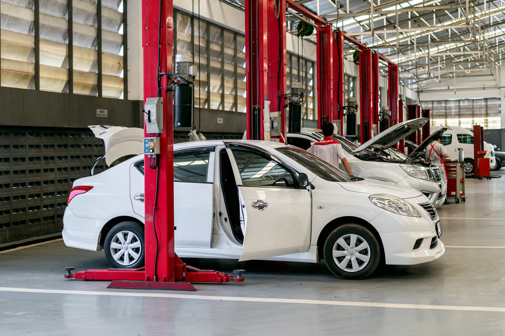 Nissan service bay Conyers GA, certified Nissan A/C repair Georgia, Conyers Nissan dealership technician, air conditioning inspection Nissan car, Nissan repair center Rockdale County, factory-trained Nissan techs, summer A/C diagnostics Conyers, Nissan sedan service Atlanta area, auto repair shop with lifts Georgia
