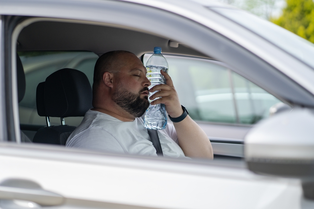 Driver hot in car Georgia, Nissan A/C failure symptoms, sweating in vehicle Conyers, auto A/C issues Atlanta area, need Nissan air conditioning service, summer heat driving discomfort, Nissan HVAC repair Conyers GA, car heat exhaustion risk Georgia