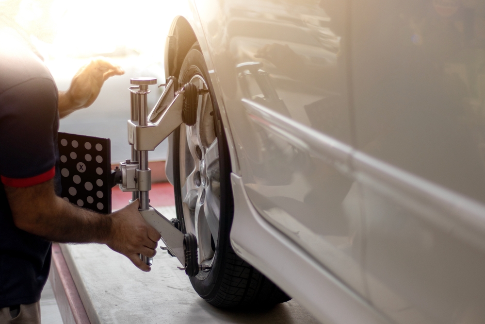 Wheel alignment affecting ADAS calibration, alignment machine on front wheel, Nissan ProPILOT Assist recalibration after alignment, Conyers GA service, Rockdale County Nissan technicians, lane keep accuracy, sensor angles, safety system maintenance