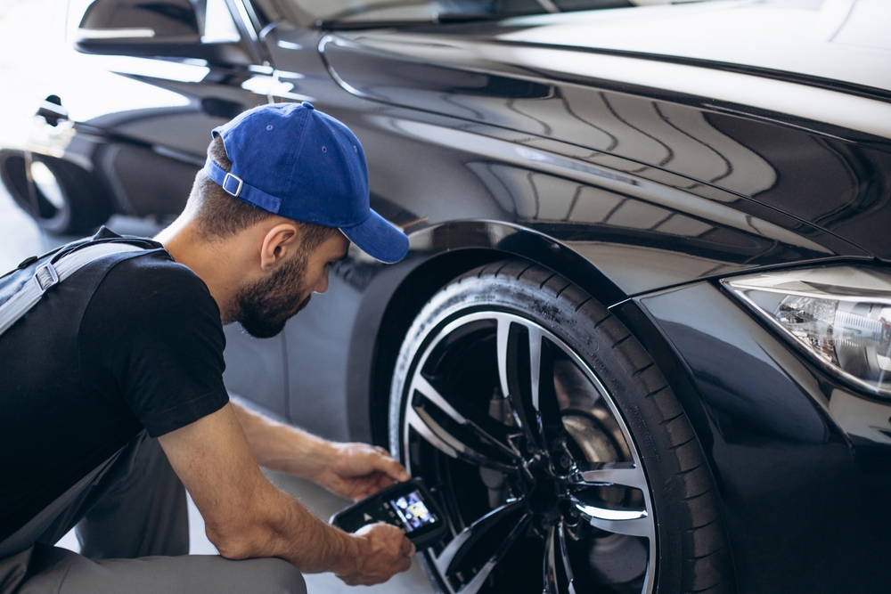 tire tread depth check Conyers Nissan, summer tire inspection Georgia drivers, Nissan dealership tire safety check, Georgia summer heat tire wear, tread gauge Nissan service Conyers, tire inspection road trip prep