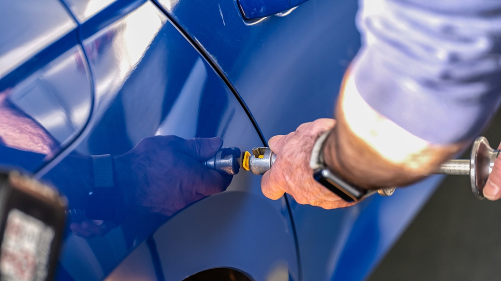 paintless dent repair Franklin TN, PDR technician fixing car door Cool Springs Collision, auto body repair Williamson County, car dent removal Franklin Tennessee, factory paint preservation vehicle repair TN