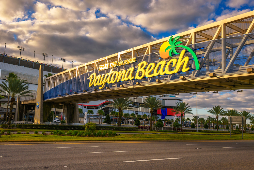 Daytona Beach welcome sign, Florida landmark I-95, Daytona Beach International Speedway area, Mercedes-Benz summer travel Florida, local service center Mercedes-Benz Daytona, hot weather driving I-95 Daytona Beach, Florida A/C service reminder