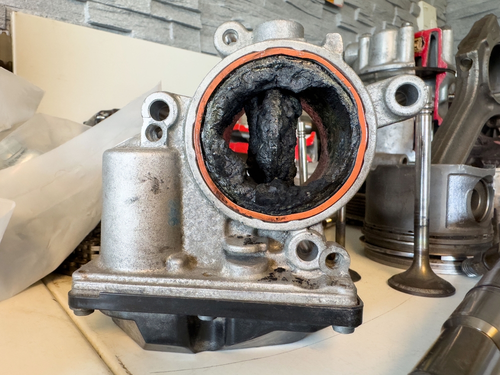 GDI intake valve carbon buildup example, Mazda SKYACTIV rough idle hesitation loss of power, Daytona Mazda Service induction cleaning, severe driving short trips moisture in oil, direct injection maintenance Florida, check engine light diagnosis, restore fuel economy and performance, Mazda service near International Speedway Boulevard