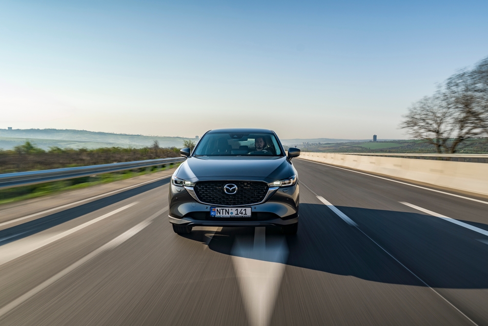 Mazda SUV highway driving fuel economy, SKYACTIV real-world MPG, preventive maintenance for efficiency, Daytona Mazda Service near I-95, schedule Mazda service online, Daytona Beach Florida road trip reliability, Mazda CX-5 CX-50 CX-90 performance