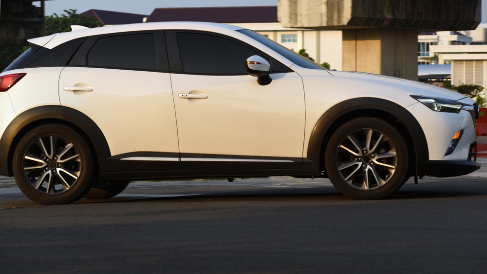 Mazda SUV in Florida sun, Daytona Beach coastal driving, Mazda sun protection Daytona, UV paint damage prevention, Mazda CX-5 CX-50 care, Mazda exterior protection tips, car paint protection Florida, Mazda service near me Daytona, protect clear coat from UV and salt air, Mazda dealership service specials Volusia County