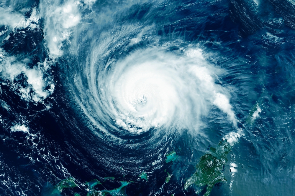 Hurricane satellite image over Atlantic, Florida storm tracking, Daytona Beach hurricane season June to November, prepare Mercedes before storm, evacuation planning coastal flooding, Florida Disaster Plan, Mercedes service Daytona Beach hurricane readiness tips