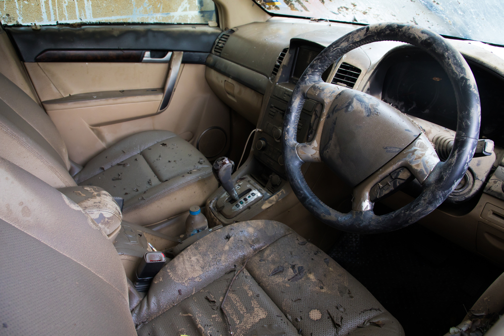 Flood-damaged Toyota interior Franklin TN, summer storm vehicle interior damage, water-logged dashboard and seats, Cool Springs Collision flood recovery repair, car electronics water exposure