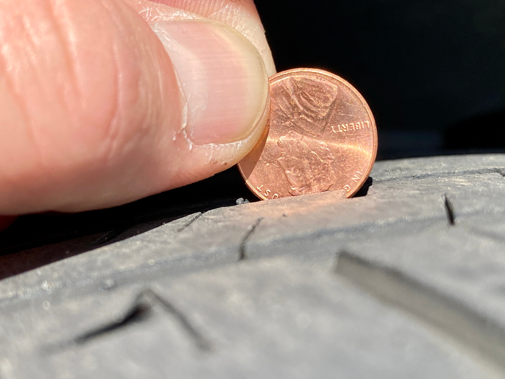 Penny test tire tread depth Franklin TN, check tire wear summer road trip, Lincoln head tire safety test, Ford vehicle tire inspection, Franklin Ford Lincoln service center tread check, summer driving tire maintenance