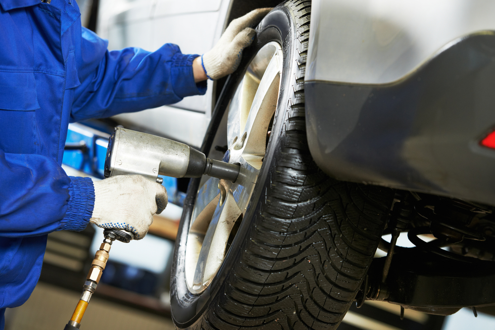 Ford Lincoln tire service Franklin TN, summer tire rotation Ford dealership, certified Ford tire installation, Franklin TN vehicle maintenance shop, professional tire alignment Ford Franklin, tire technician rotating wheels Tennessee