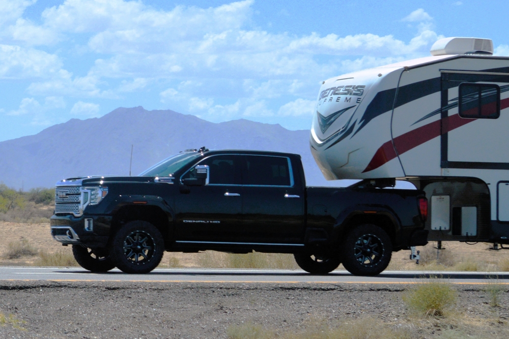 Ford Super Duty towing fifth-wheel RV, heavy-duty truck hauling on Tennessee highway, towing stress on suspension, F-350 F-450 trailer sway control braking downhill, Ford truck towing capacity, Murfreesboro haulers, payload and hitch weight, Super Duty shocks springs bushings working under load, safe towing tips Middle Tennessee