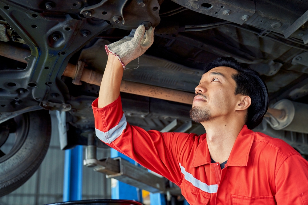 Ford of Murfreesboro suspension inspection, mechanic checking undercarriage, Ford truck shocks struts control arms bushings, F-150 suspension service Murfreesboro TN, Super Duty suspension repair Tennessee, Ford service center Rutherford County, truck underbody exam for clunking rattling uneven tire wear, certified Ford technician, alignment and safety inspection, heavy towing maintenance