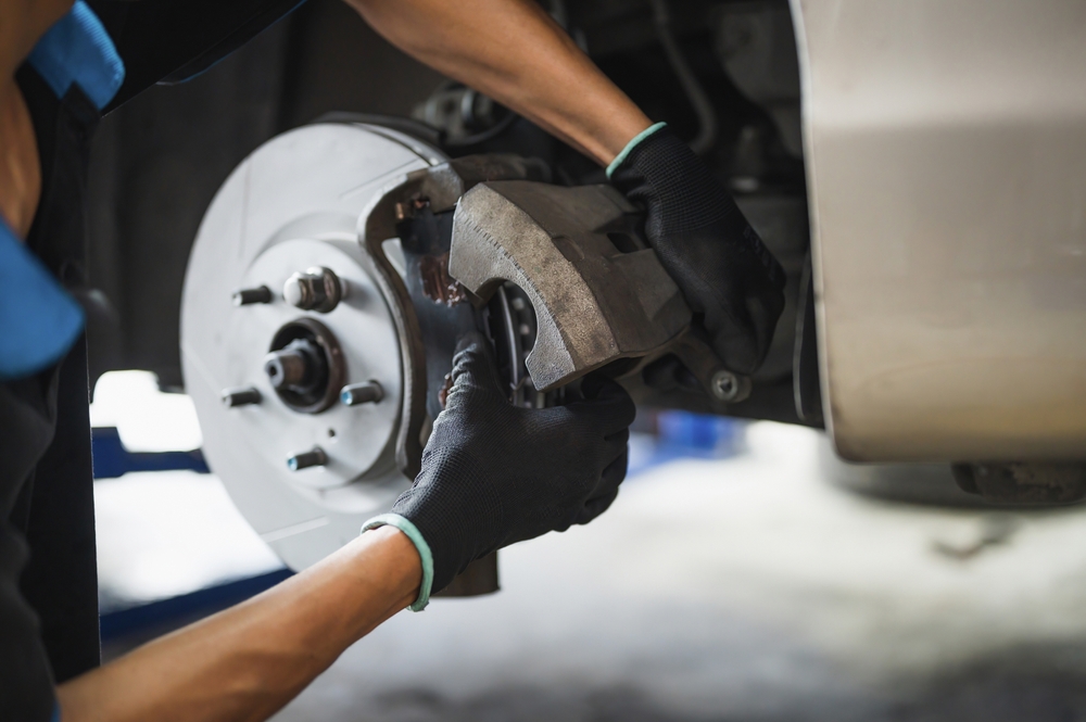 Nissan brake inspection Gainesville FL, rotor and brake pad check, wet weather stopping distance +25%, Gainesville Nissan Service complimentary brake inspection, Genuine Nissan Parts, brake safety for Florida rainy season, Archer Road and Newberry Road traffic, brake caliper service in Gainesville auto shop, Nissan-certified technicians, Gainesville car maintenance specials