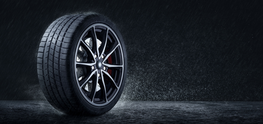 Gainesville Nissan Service rainy season prep, performance tire tread channels dispersing water, hydroplaning prevention Gainesville FL, tire safety check 4/32 tread depth, complimentary tire inspection and pressure adjustment, Nissan Rogue Altima Sentra Pathfinder tires, wet weather traction on University Avenue and I-75, Alachua County thunderstorms, Genuine Nissan Parts and tires Gainesville