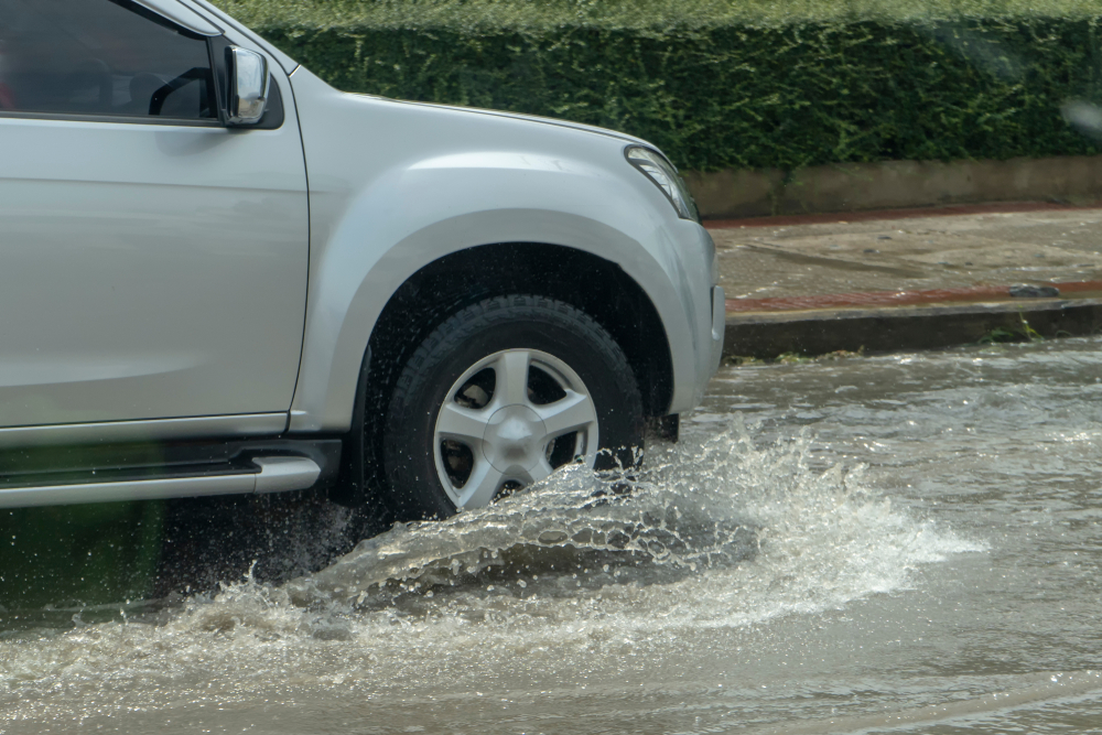 Ford F-150 flood driving Palm Bay FL, Ford Explorer navigating hurricane conditions, flooded roads Palm Bay Ford storm tips, high-clearance vehicle hurricane season, Gary Yeomans Ford flood preparedness, Space Coast storm readiness Ford SUV truck