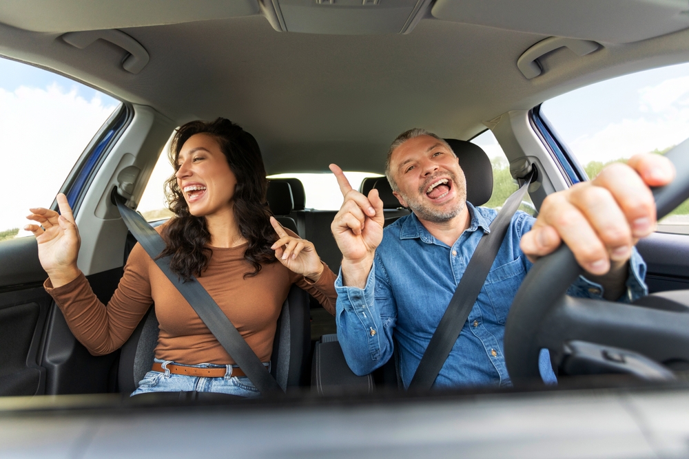 happy Volkswagen drivers, cool summer car interior VW, Stone Mountain Volkswagen AC repair results, comfortable car ride Atlanta heat, VW A/C recharge Snellville GA, summer road trip Volkswagen, cool air Volkswagen interior