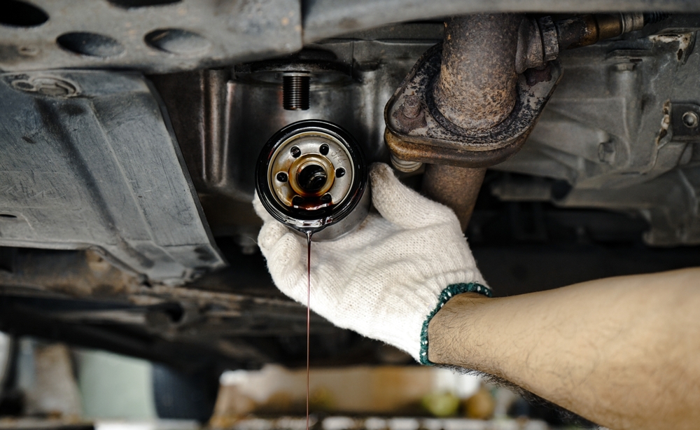 Honda oil change service in Louisville KY, underbody oil filter replacement, Honda-certified oil change, summer vehicle maintenance, Louisville Honda World service, genuine Honda oil filter installation, Honda warranty protection, oil leak inspection Louisville, Honda undercarriage maintenance, same-day Honda oil change Louisville