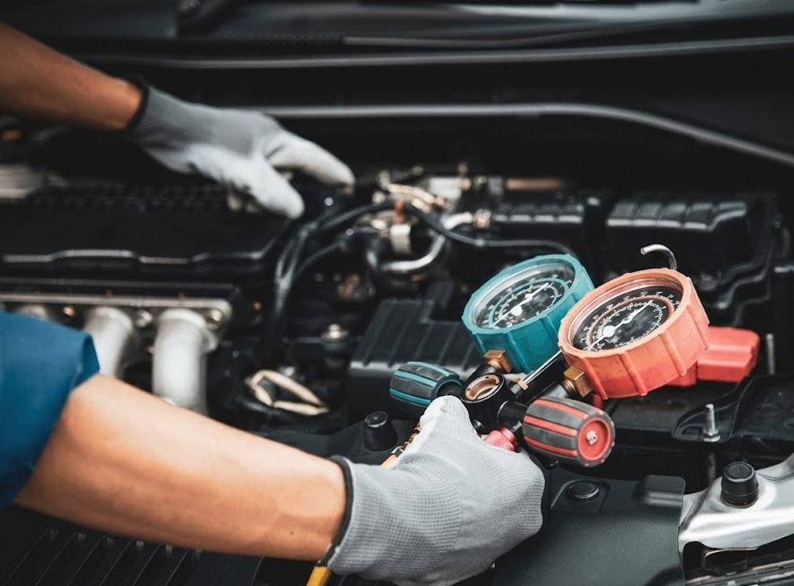 auto technician performing coolant flush service, pressure equipment connected under hood, professional Hyundai cooling system maintenance, genuine Hyundai coolant service Cookeville TN, protecting aluminum engine from corrosion and freezing, winter prep service for Hyundai Tucson Santa Fe Palisade, coolant system inspection before holiday travel, Hyundai of Cookeville Service Center bay