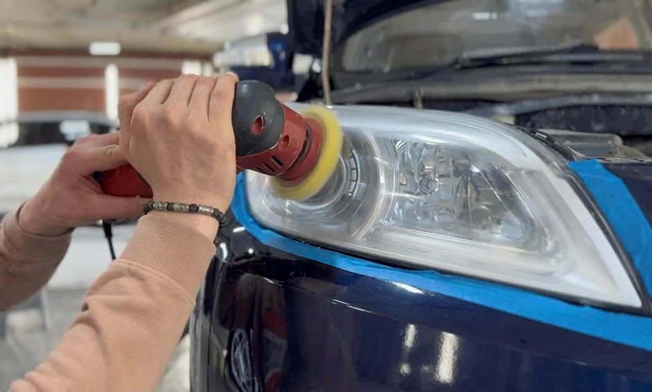 auto technician polishing cloudy headlight lens, professional headlight restoration service Cookeville TN, Hyundai of Cookeville Service Center UV damaged headlight repair, restoring factory clarity to Hyundai headlights, improve nighttime visibility on rural Tennessee roads, affordable alternative to headlight replacement, protecting Hyundai advanced driver-assist systems, genuine Hyundai parts and certified technicians