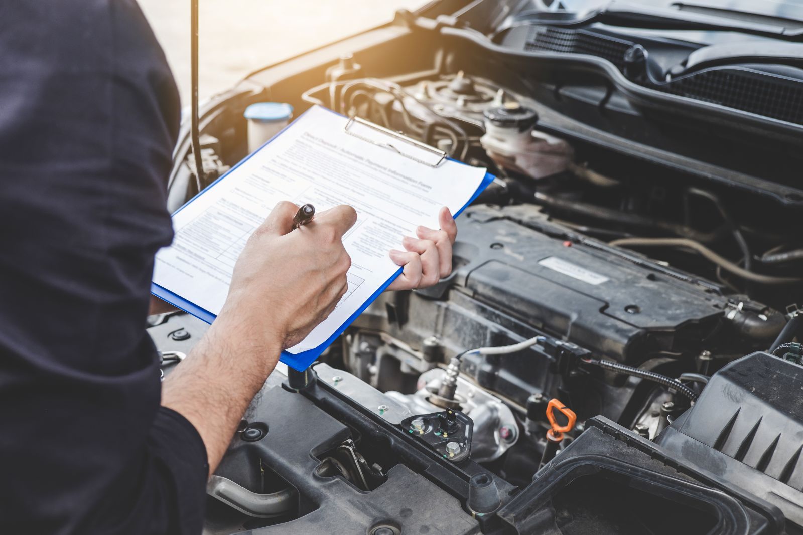 INFINITI certified technician performing 167-point inspection at Daytona INFINITI service center in Daytona Beach FL