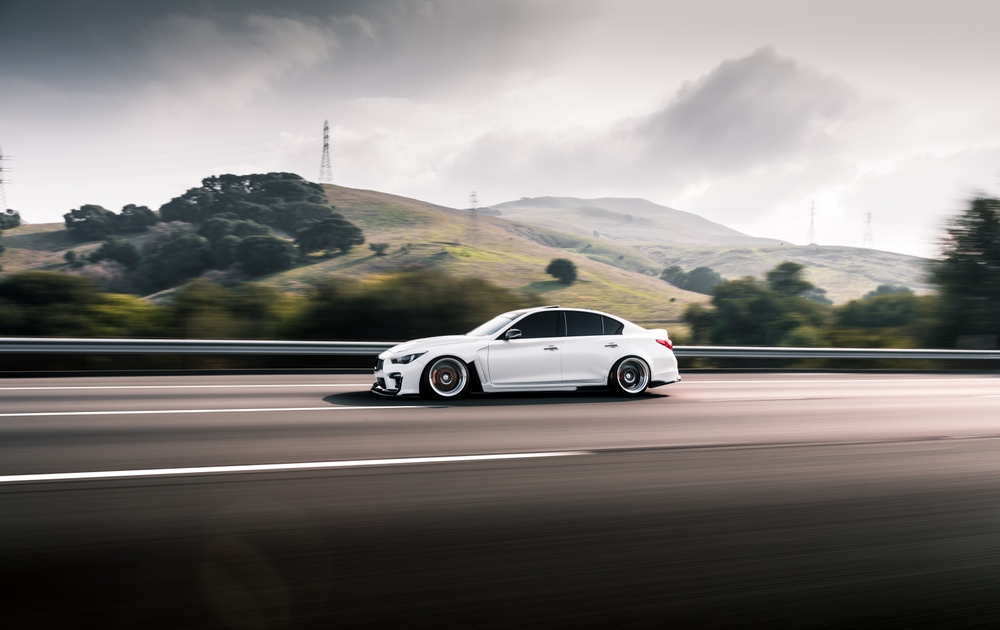INFINITI Q50 highway driving North Carolina, luxury sedan Lake Norman, Cornelius INFINITI performance, brake fluid flush before road trip, scenic drive INFINITI near Jetton Park and Catawba Avenue, high-speed braking safety INFINITI Q50