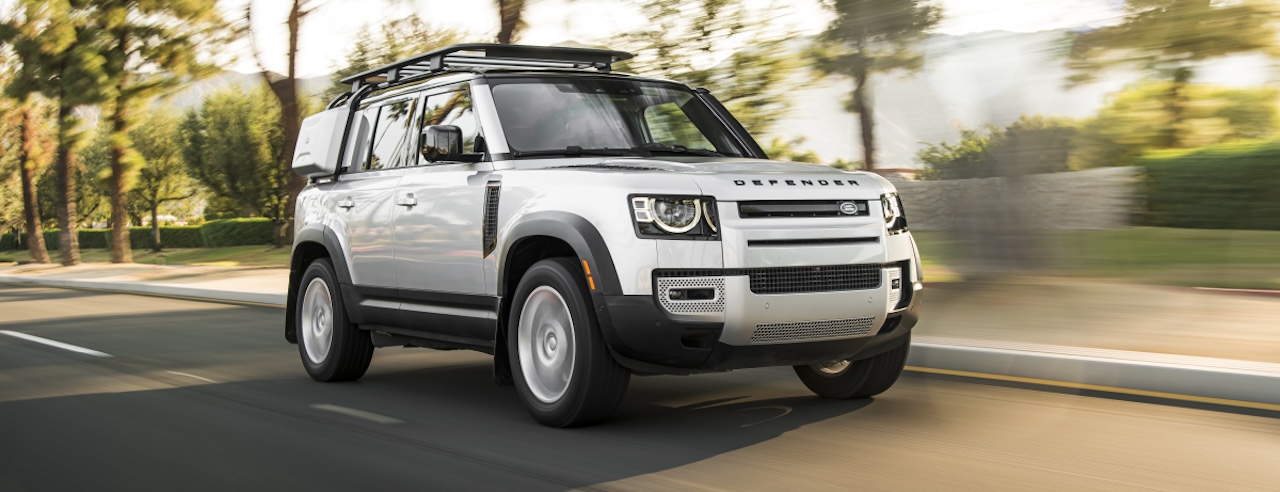 Land Rover Defender white SUV driving near Orlando at Land Rover South Orlando