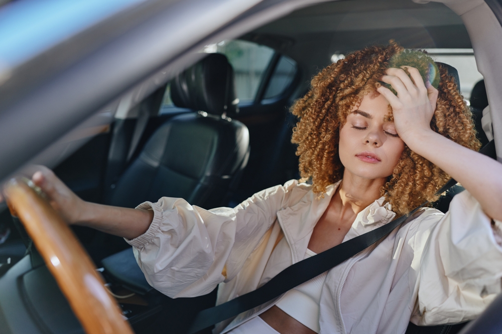 Woman overheated in car, car A/C problems Louisville, hot car interior summer, Honda air conditioning failure, A/C repair needed in Honda, hot day no air conditioning Louisville, driver sweating Honda Civic, AC not cooling Honda Accord, Honda air conditioning service Louisville KY, summer heat car discomfort Honda