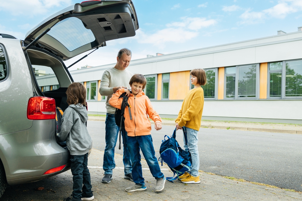 Honda school drop-off Louisville KY, family loading into Honda SUV for school, back to school Honda safety, Honda CR-V family commuter, reliable Honda back-to-school Louisville