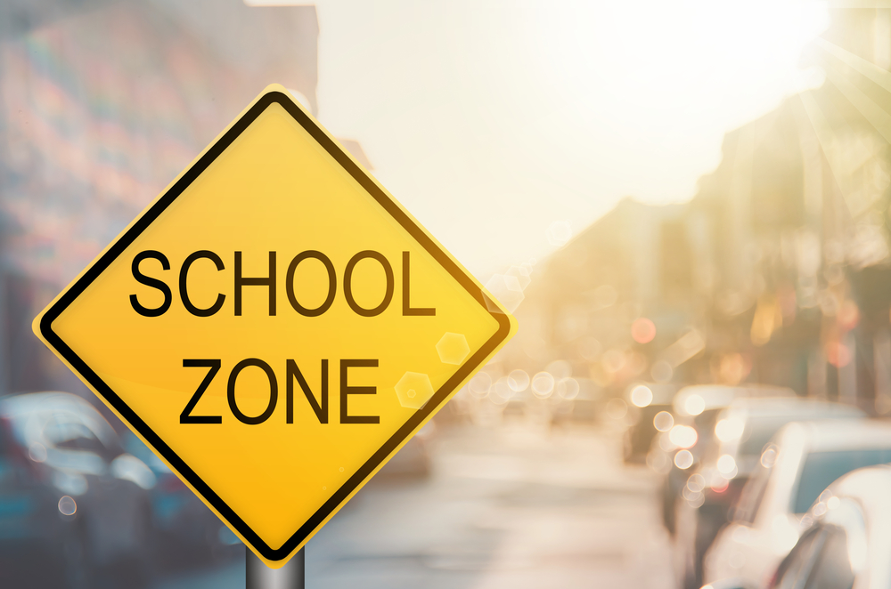 School zone Louisville KY, Honda driving safety near school zone, Honda brake check for school zones, back to school car safety Louisville, yellow school zone traffic sign for safe Honda driving
