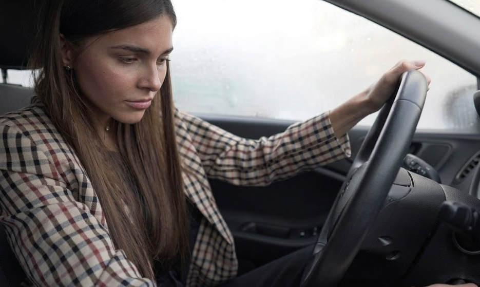 worried driver in parked car on freezing Louisville KY morning, car will not start, weak car battery in cold weather, winter starting problems, Honda sedan stranded in driveway, frosted windows and breath in the air, Louisville Honda World Service battery failure symptoms, Honda battery check before winter, car won’t crank in Jefferson County, protect your Honda with 100 month battery warranty, Honda service center near Louisville Kentucky