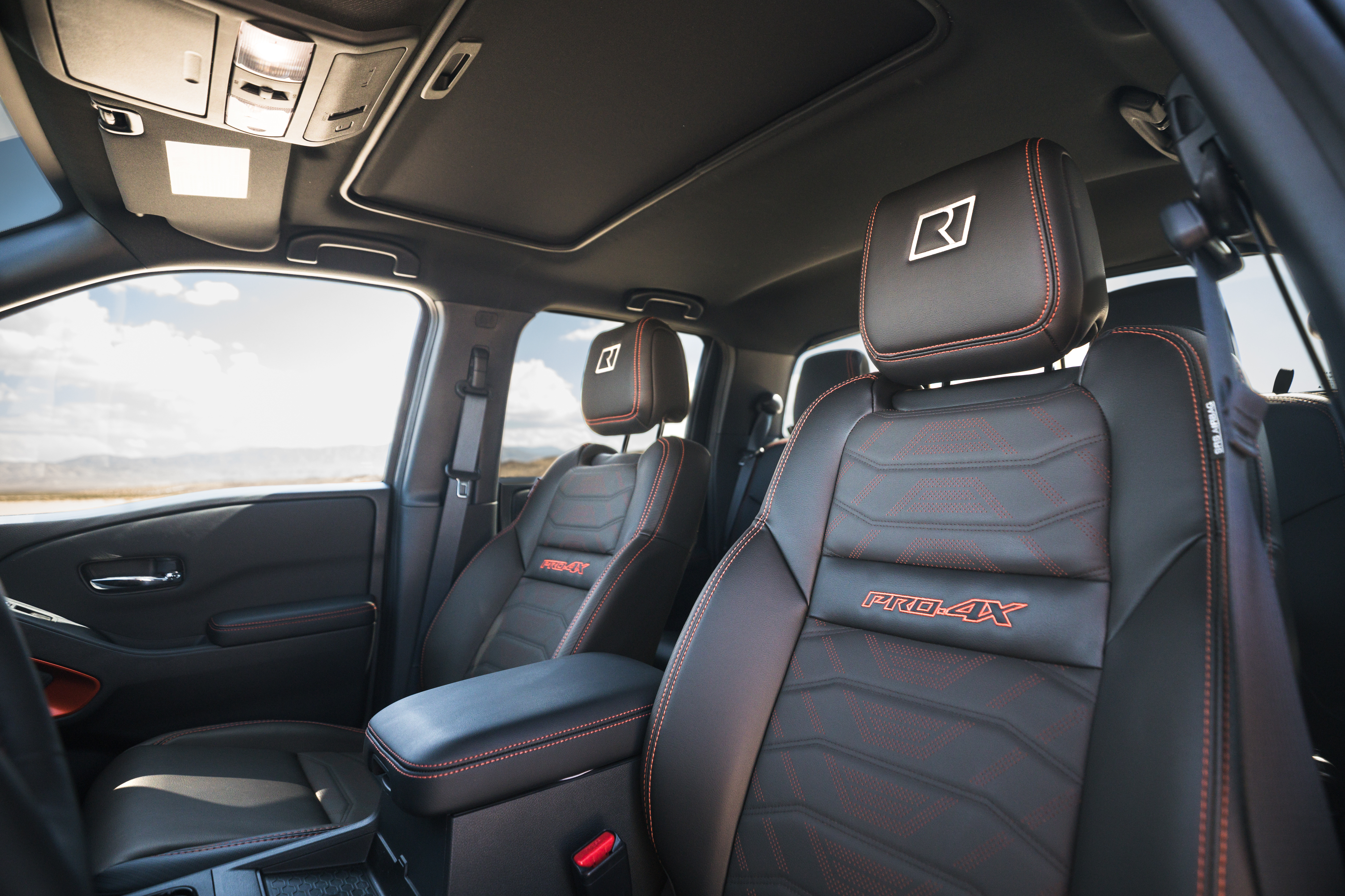 Interior of the 2025 Nissan Frontier with modern tech and durable materials.