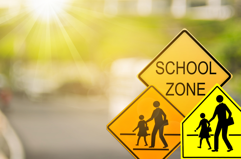 School zone safety Long Island Mercedes-Benz, Massapequa NY school zone traffic sign, Mercedes-Benz brake service for school safety, school season road sign New York, Mercedes family vehicle school zone awareness