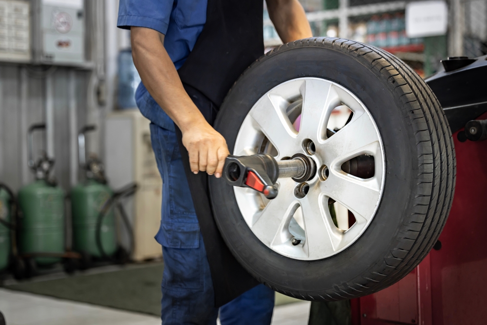 tire rotation McDonough Nissan, Nissan Rogue tire rotation Henry County, certified technician rotating tire Georgia, back to school tire service McDonough GA, Nissan tire safety maintenance