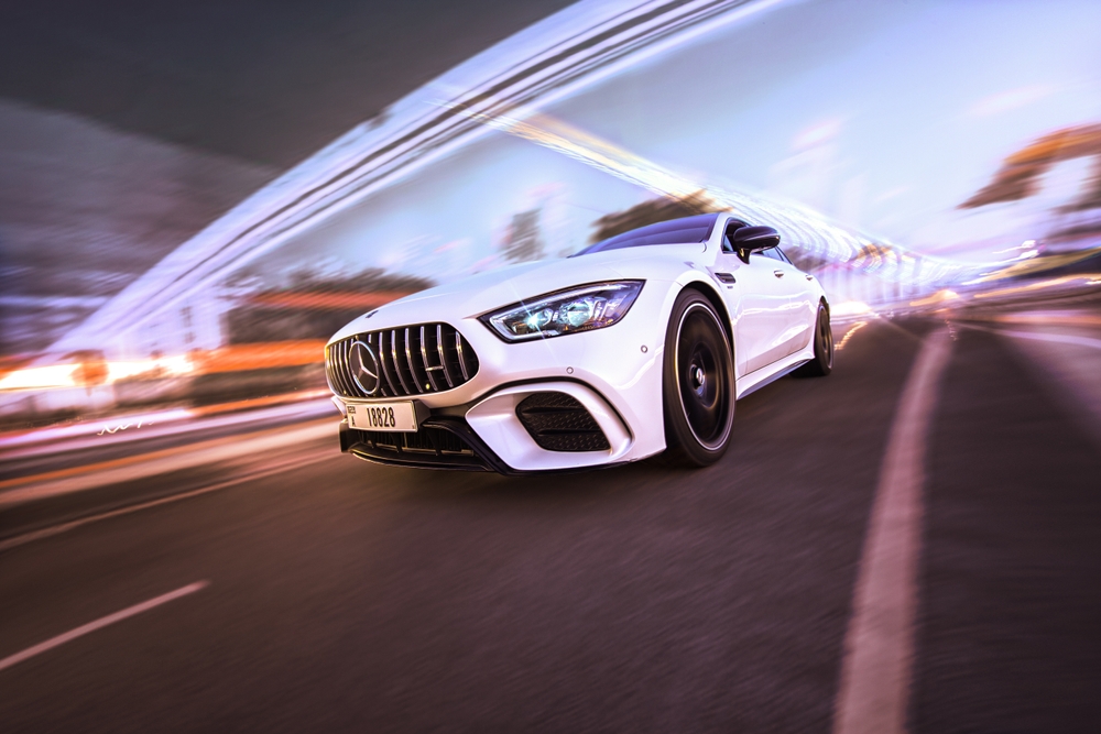 Mercedes-AMG in motion at dusk, push-to-start Keyless-GO system, Mercedes reliability after key fob battery replacement, Front Range Colorado driving, Mercedes-Benz of Westminster Service, Keyless-GO emergency start and software update, luxury car service Denver area