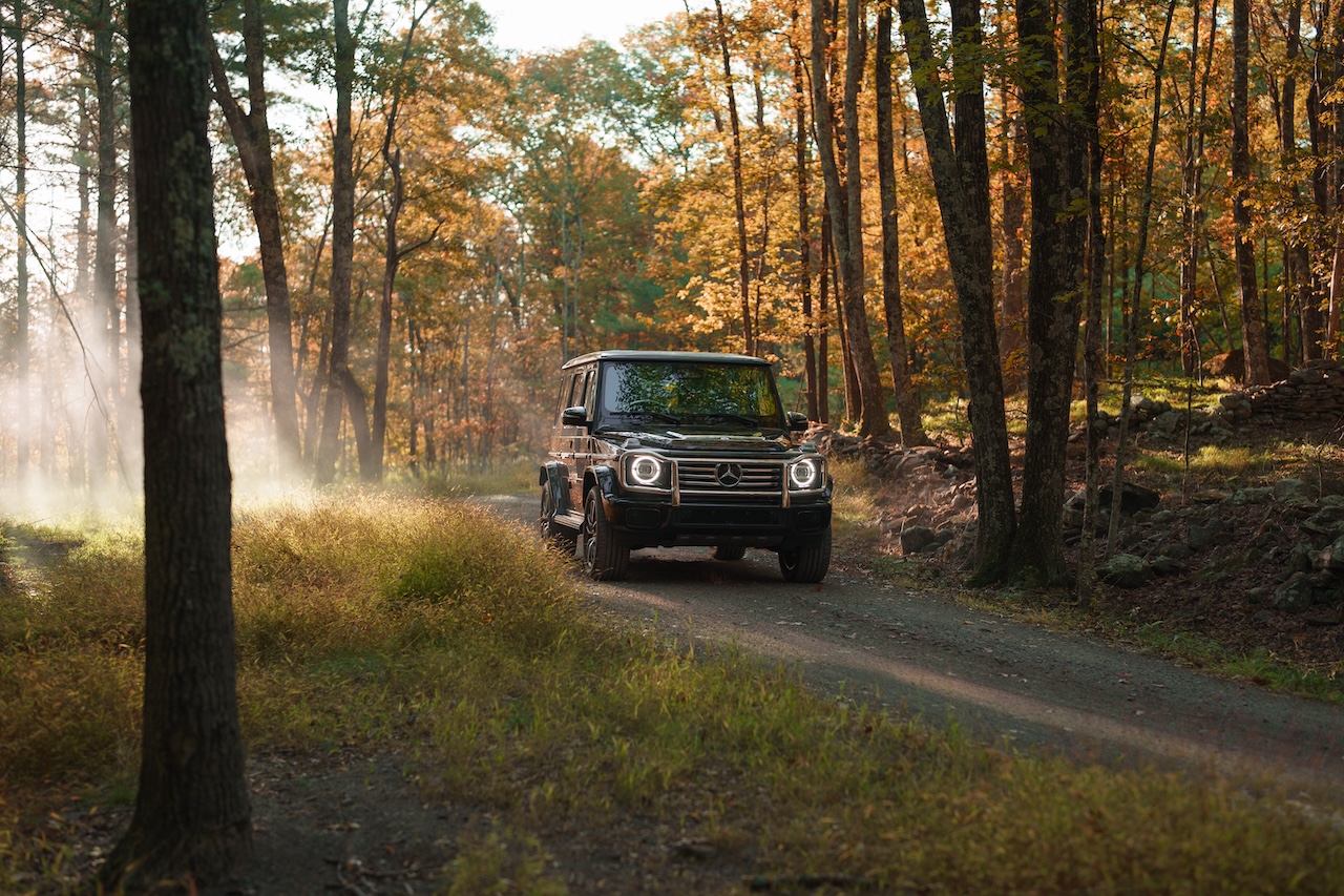 A Mercedes-Benz SUV in a forest setting, representing lease-end assistance from Mercedes-Benz of Loveland near Loveland, CO