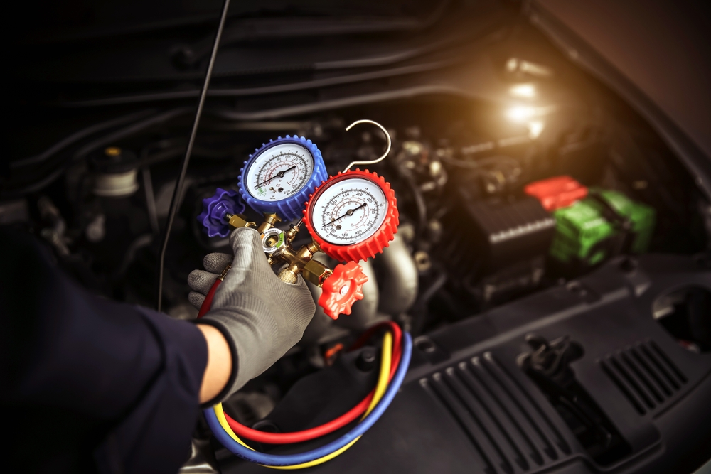 Mercedes-Benz A/C pressure gauge tools, Mercedes-Benz climate control diagnostics, certified air conditioning service Massapequa NY, Long Island luxury car cooling repair, refrigerant level check Mercedes, high-performance automotive A/C repair Nassau County, Mercedes-Benz of Massapequa service technician